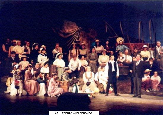 opera este un termen desemnand o forma de teatru, fiind deseori denumita teatru liric, in care